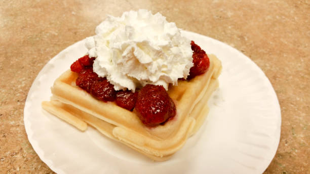 istock Waffle with strawberries and whip cream 644934378