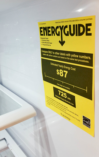 Eugene, OR, USA - December 17, 2016; A EnergyGuide label inside a refrigerator in Eugene, OR.  A EnergyGuide gives consumers the yearly operating cost for the appliance. The Energy Policy and Conservation Policy of 1975, which is regulated by the Federal Trade Commission (FTC) to make sure consumers are aware of costs of major appliances and lighting.
