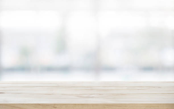 istock Wood table top on glass wall abstract background. 644952280