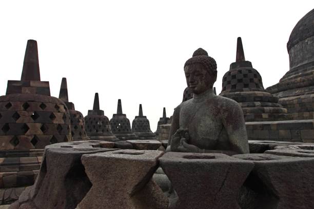 istock Buddha statue in stupa, Borobudur, near Yogyakarta, Java, Indonesia 644959950