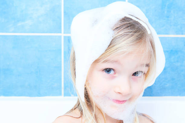 istock Child blond girl taking bath 644966492