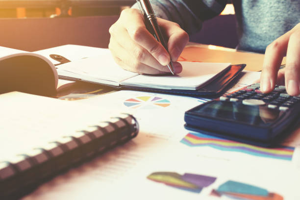 istock Businesswoman writing make note and calculate about cost at home. 644974408