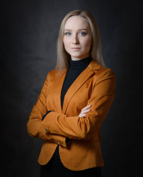 istock Woman in orange suit. 644976970