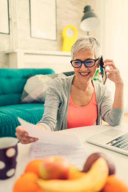 istock Mature woman Home budgeting 644987470