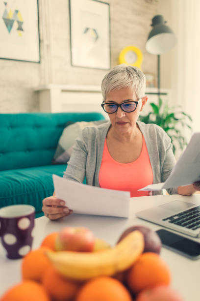 istock Mature woman Home budgeting 644987574