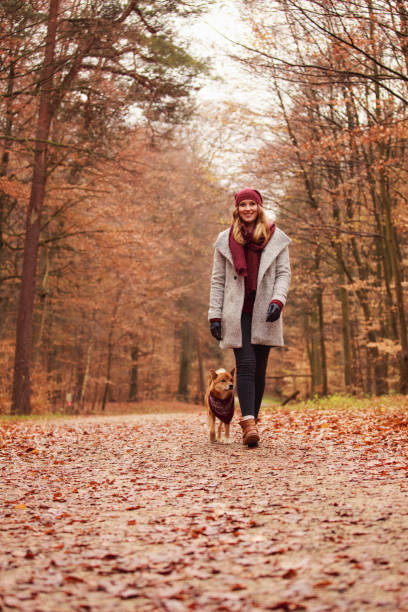 istock Young woman with her dog 644990300
