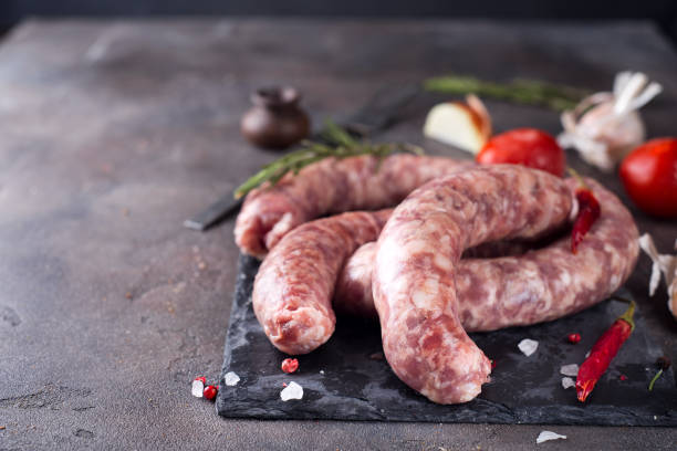 istock Raw sausages on slate 644993958