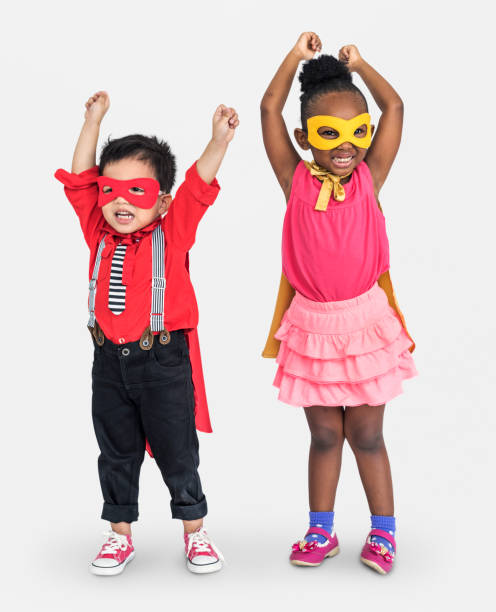 istock Superheroes diverse kids arm raised with smile full body 645002092