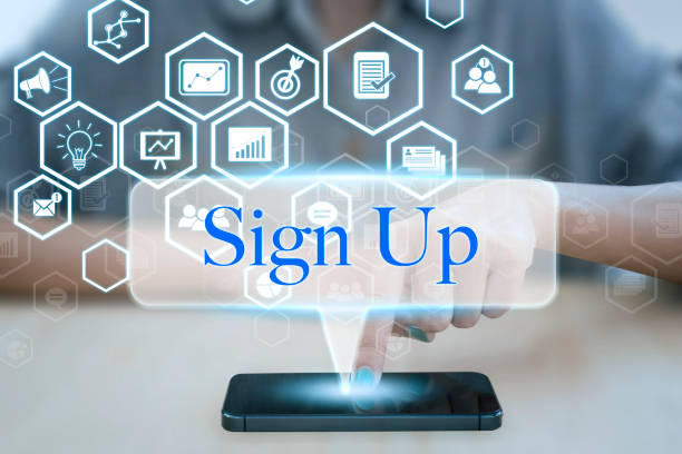 istock Woman using smart phone pressing button sign up icon. 645005052