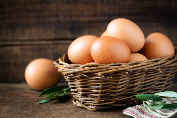 Fresh eggs in a basket stock photo