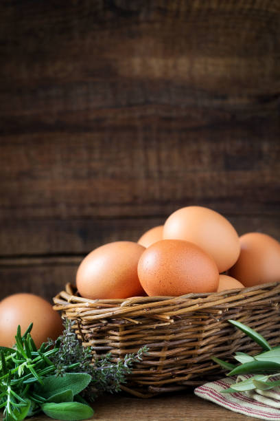 istock Fresh eggs in a basket with provencal herbs 645005790