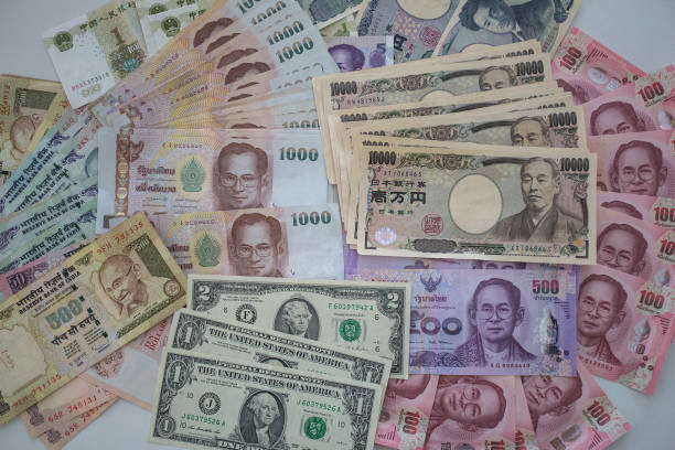 istock Multiple Currencies banknotes as colorful background 645008960