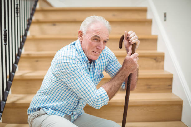 istock Tired senior man sitting on stairs 645011976