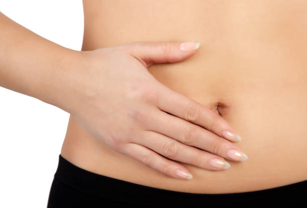istock woman with stomach ache 645014752