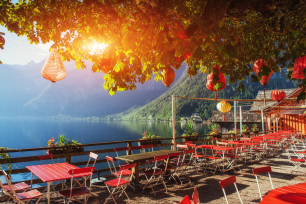 istock Summer cafe on the beautiful lake between mountains. Alps. Halls 645014962
