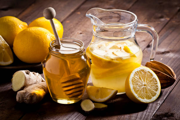 istock Preparing lemon infused water with honey and ginger 645016018