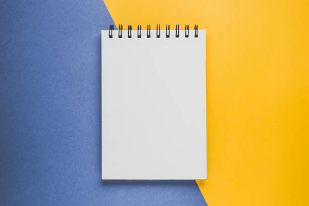 istock Notebad or sketchbook  on the yellow-blue background. Creativity concept 645016628