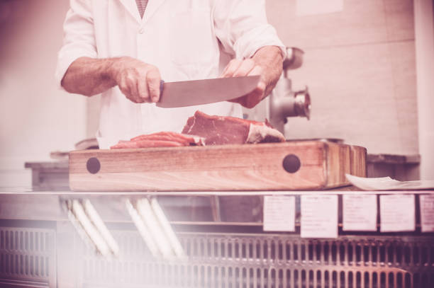 istock Butcher Cutting the Steaks 645019590