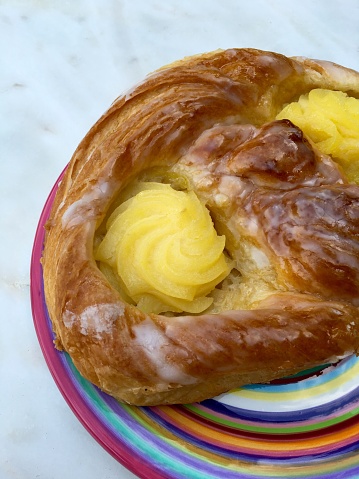 Danish pastry with pudding on a colorful plate
