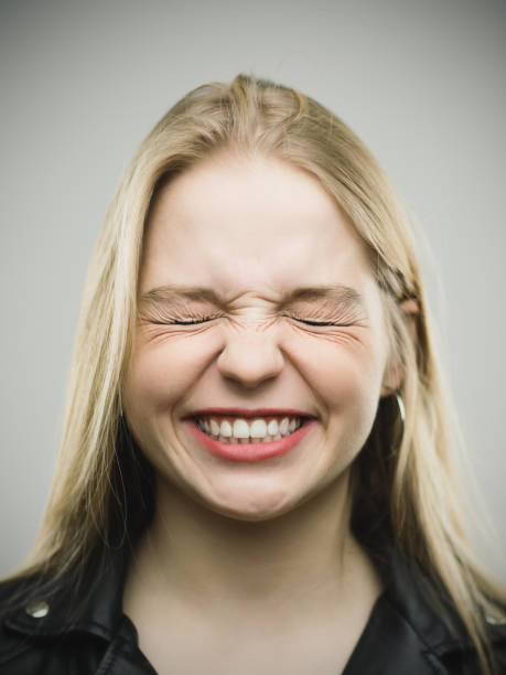 istock Angry young woman clenching teeth 645022688