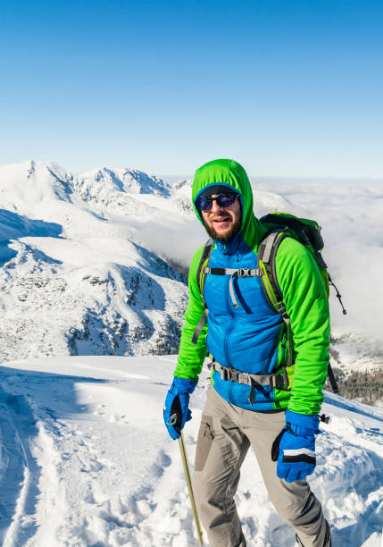 istock Hiker with ice axe winter in the mountains. 645027758
