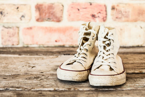 istock Old shoes on wooden background 645043962
