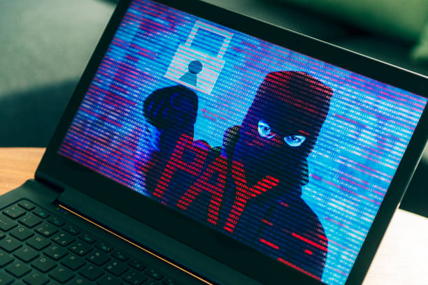 Ransomware on pc with criminal asking for money stock photo