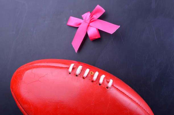 istock Women playing Australian rules Football 645051882