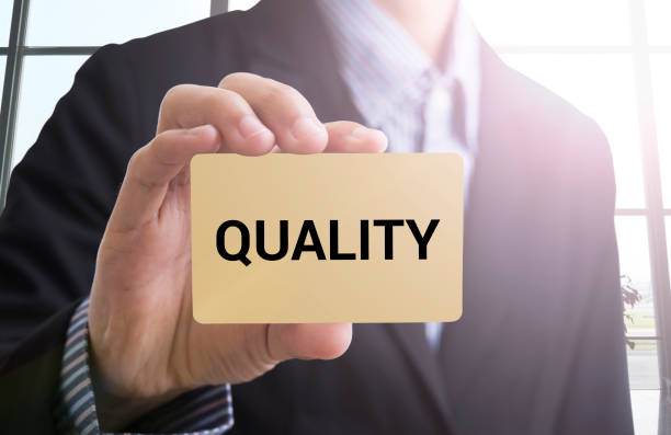 istock Businessman hand select wording quality. sign on virtual screen. 645051916