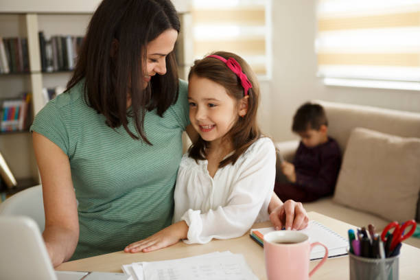 istock Mother with children working from home 645056326