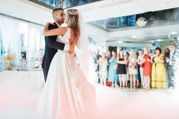 istock Happy bride and groom their first dance 645056446