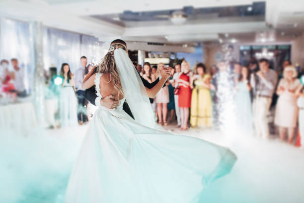 istock Happy bride and groom their first dance 645056512