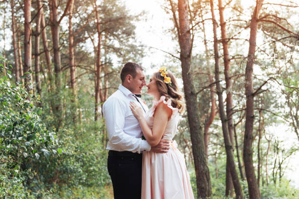 istock Happy couple in a pine forest Beauty world 645056666