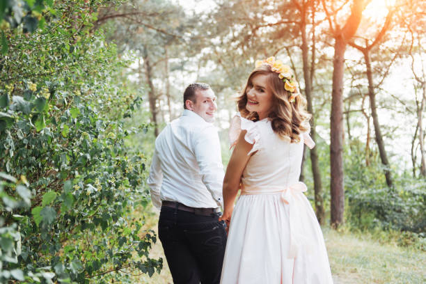 istock Happy couple in a pine forest Beauty world 645060084