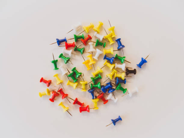 istock Push pins in different colors on a pastel background. 645067496