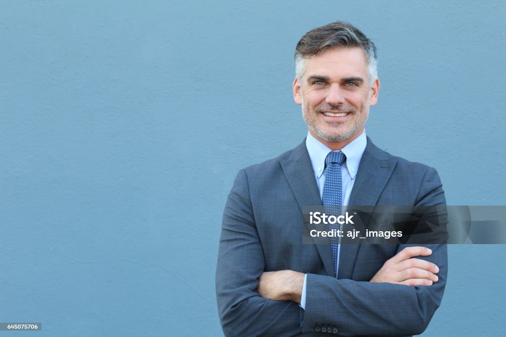 Mature businessman smiling wearing classic suit Mature businessman smiling wearing classic suit. Men Stock Photo