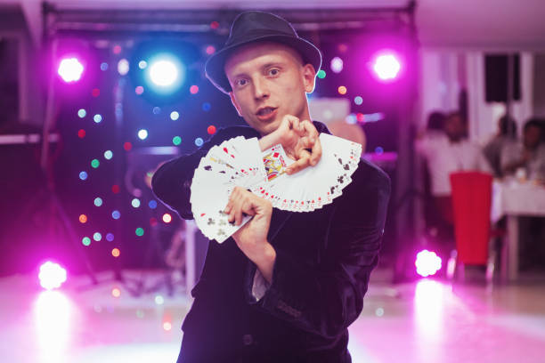 istock Magician showing trick with playing cards. Magic, circus 645080510