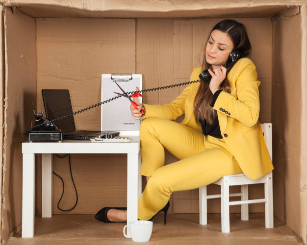 istock call center employee cuts the cable from the phone handset, 645080556