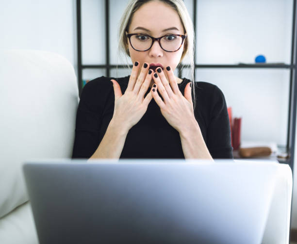istock Beautiful young woman working with laptop 645081564