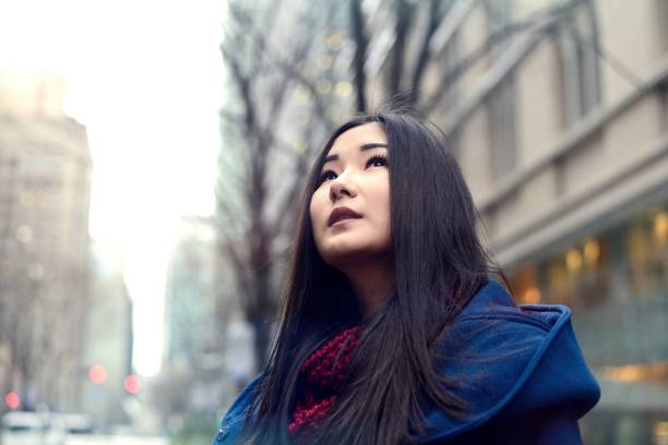 istock Girl looking at buildings 645085084
