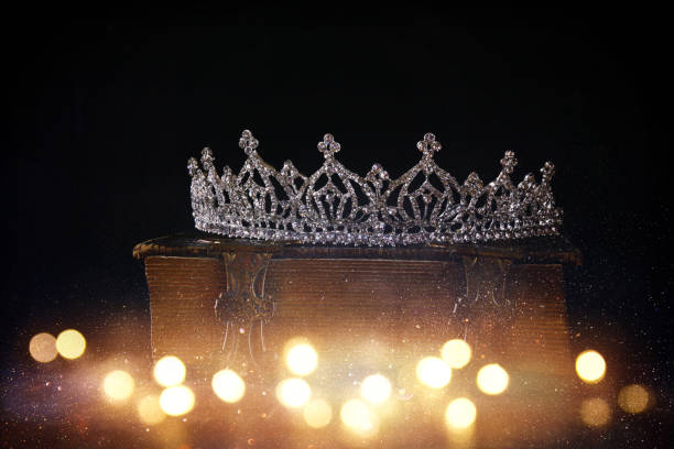 istock low key of diamond queen crown on old book 645085484