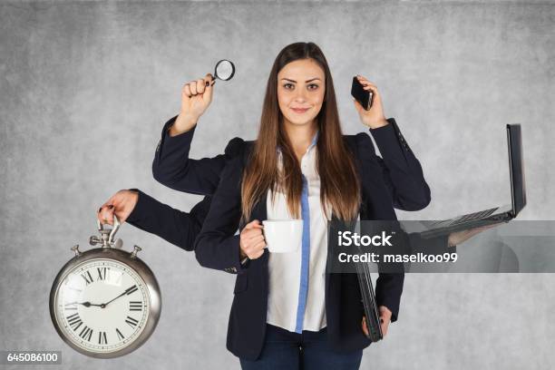 Multipurpose Business Woman With A Large Number Of Hands Stock Photo - Download Image Now