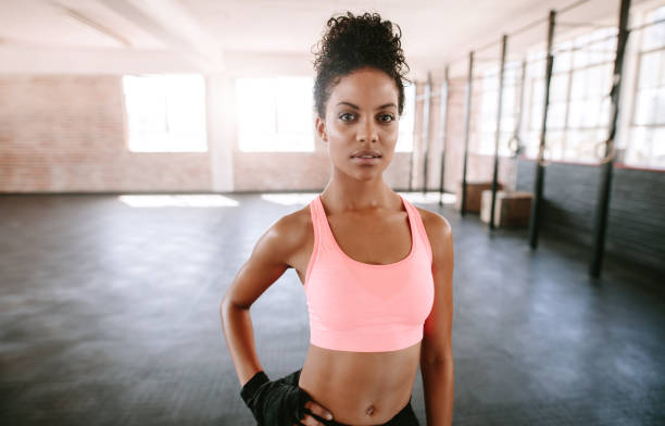 istock Fit young woman standing in gym 645089478