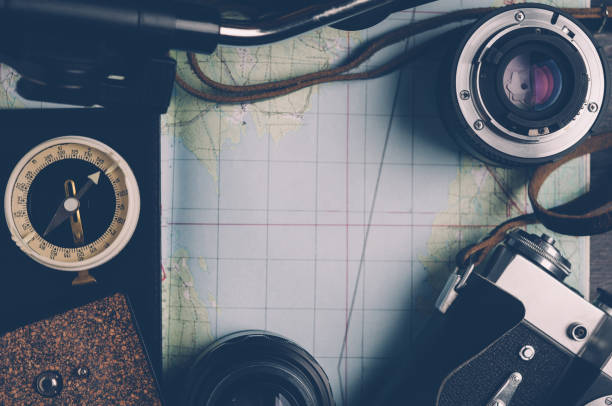 istock Old compass and photo equipment. Travel concept 645092678