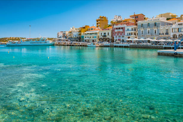 Agios Nikolaos on Crete AGIOS NIKOLAOS, CRETE, GREECE - MAY 6, 2015: Seaside resort town of Agios Nikolaos located on the north-east side of Crete, Greece. inlet photos stock pictures, royalty-free photos & images