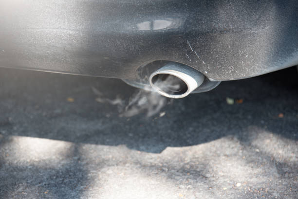 istock black car dual exhaust pipe with smoke 645093162