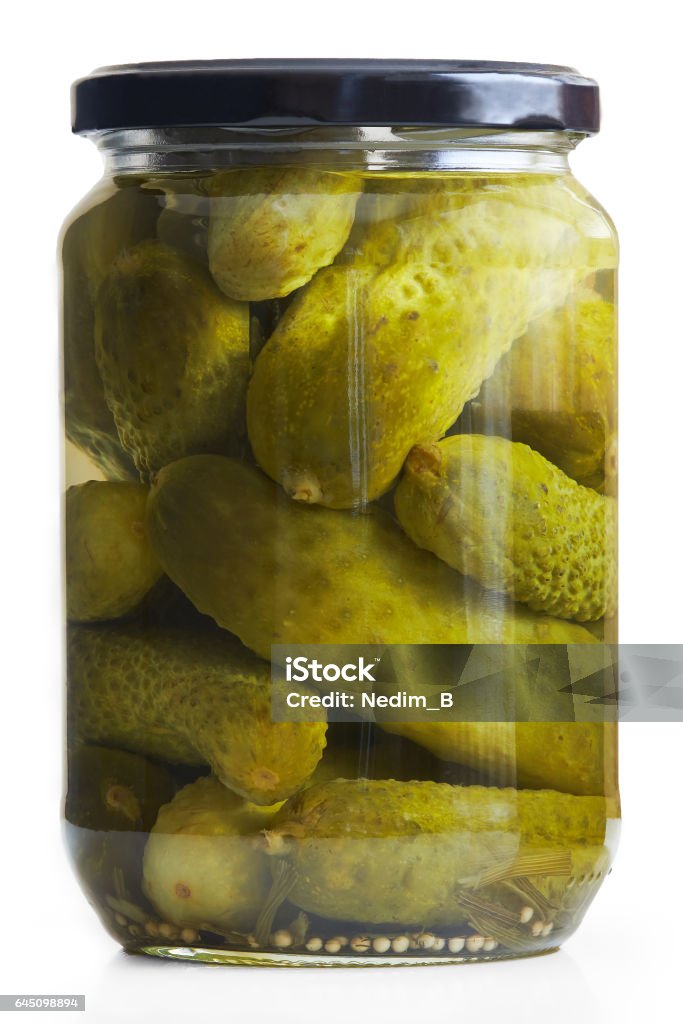 Preserved pickled cucumbers Jar of pickled cucumbers isolated on white background Pickle Stock Photo