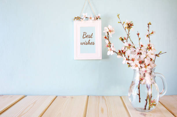 istock Photo frame next to spring white flowers 645107352