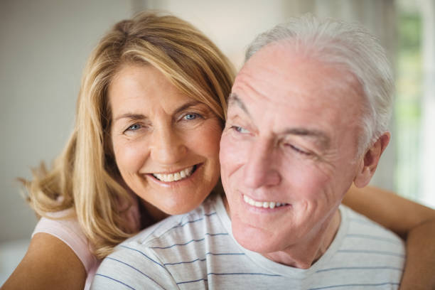 istock Smiling woman embracing man 645107470