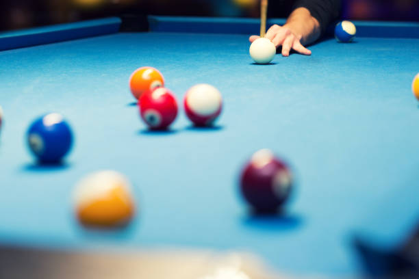 istock pool billiard, hand aiming the cue ball 645107510